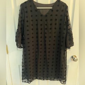 Black dress with sheer overlay